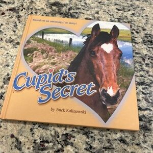 Cupid's Secret hardcover book by Buck Kalinowski. Signed edition.